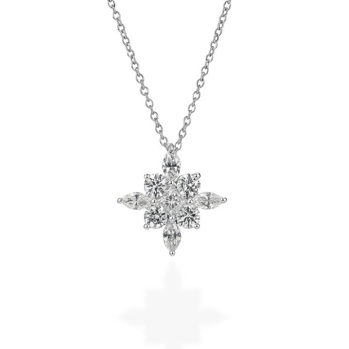 Diamond starburst pendant on a chain against a white background